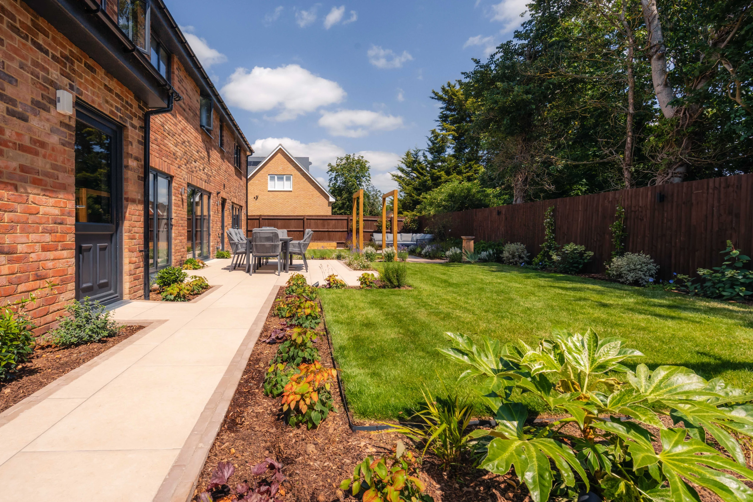 Image shows the lawn and bedding areas of a newly designed garden
